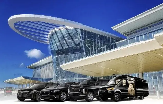 Luxury black car and van fleet parked in front of Orlando International Airport (MCO) Terminal C Luxury black car and van fleet parked in front of Orlando International Airport (MCO) Terminal C