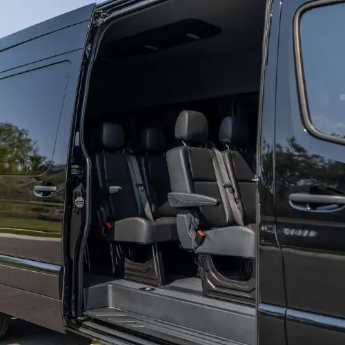 Spacious interior with leather seating in a luxury Sprinter van rental in Orlando, ideal for professional group transport